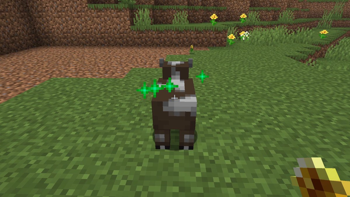 A baby cow with green particles after being fed a golden dandelion
