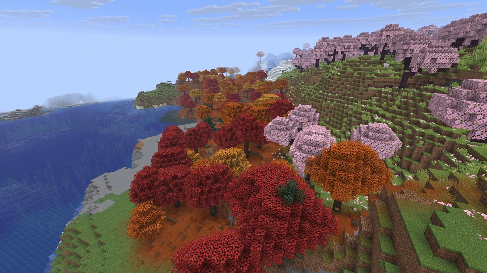Minecraft screenshot: a Dappled Forest with red, orange and yellow poplar trees next to a cherry grove and a lake, seen from above