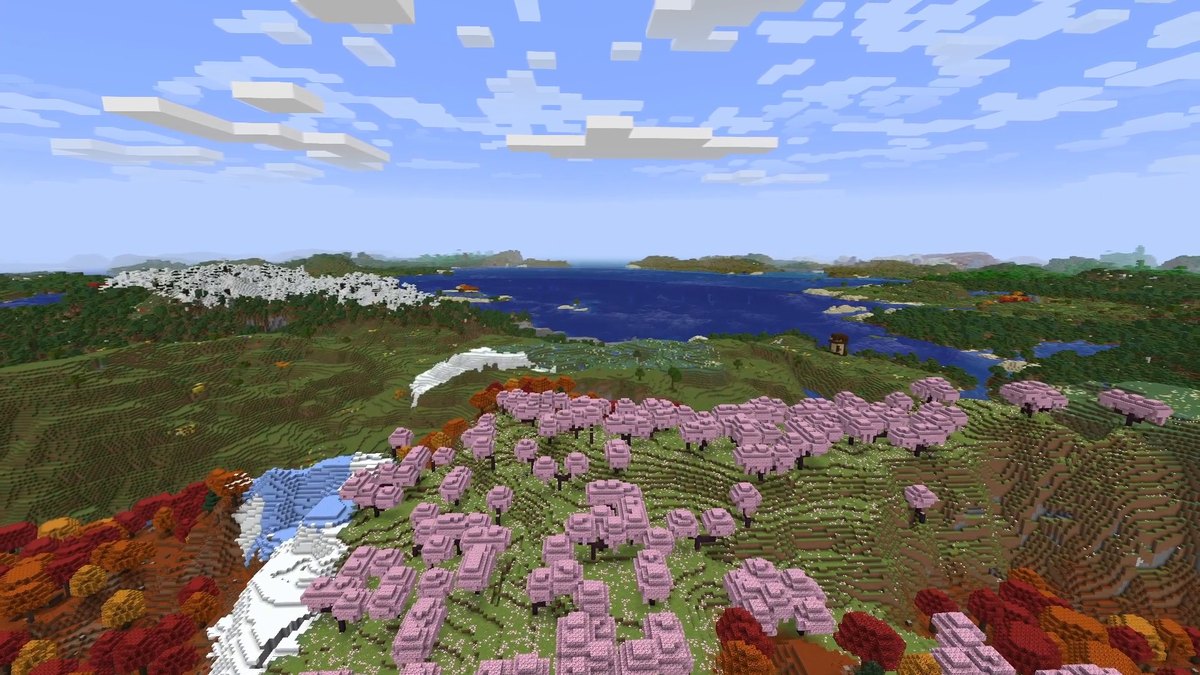 Minecraft screenshot with Distant Horizons looking over autumn and cherry forests to a lake and distant mountains