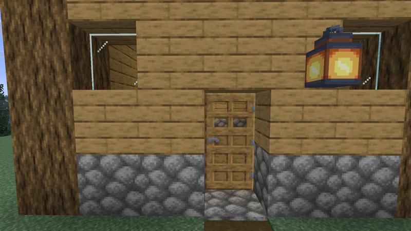Split Minecraft screenshot of a house front with a door, cobblestone and a lantern: left half vanilla, right half with sharper Faithful 32x textures