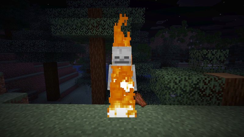 Split Minecraft screenshot at night: left half vanilla and dark, right half with LambDynamicLights where the torch in hand lights up the ground