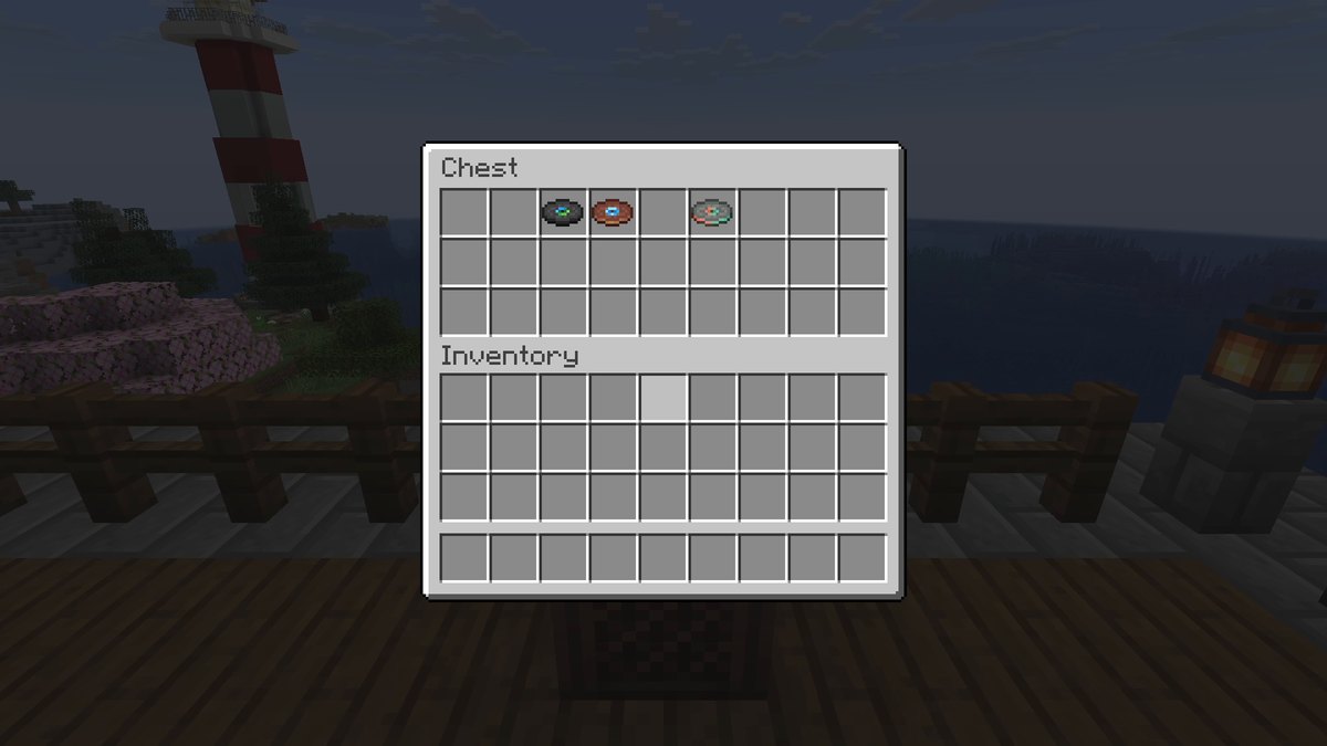 Chest inventory with three music discs and empty slots